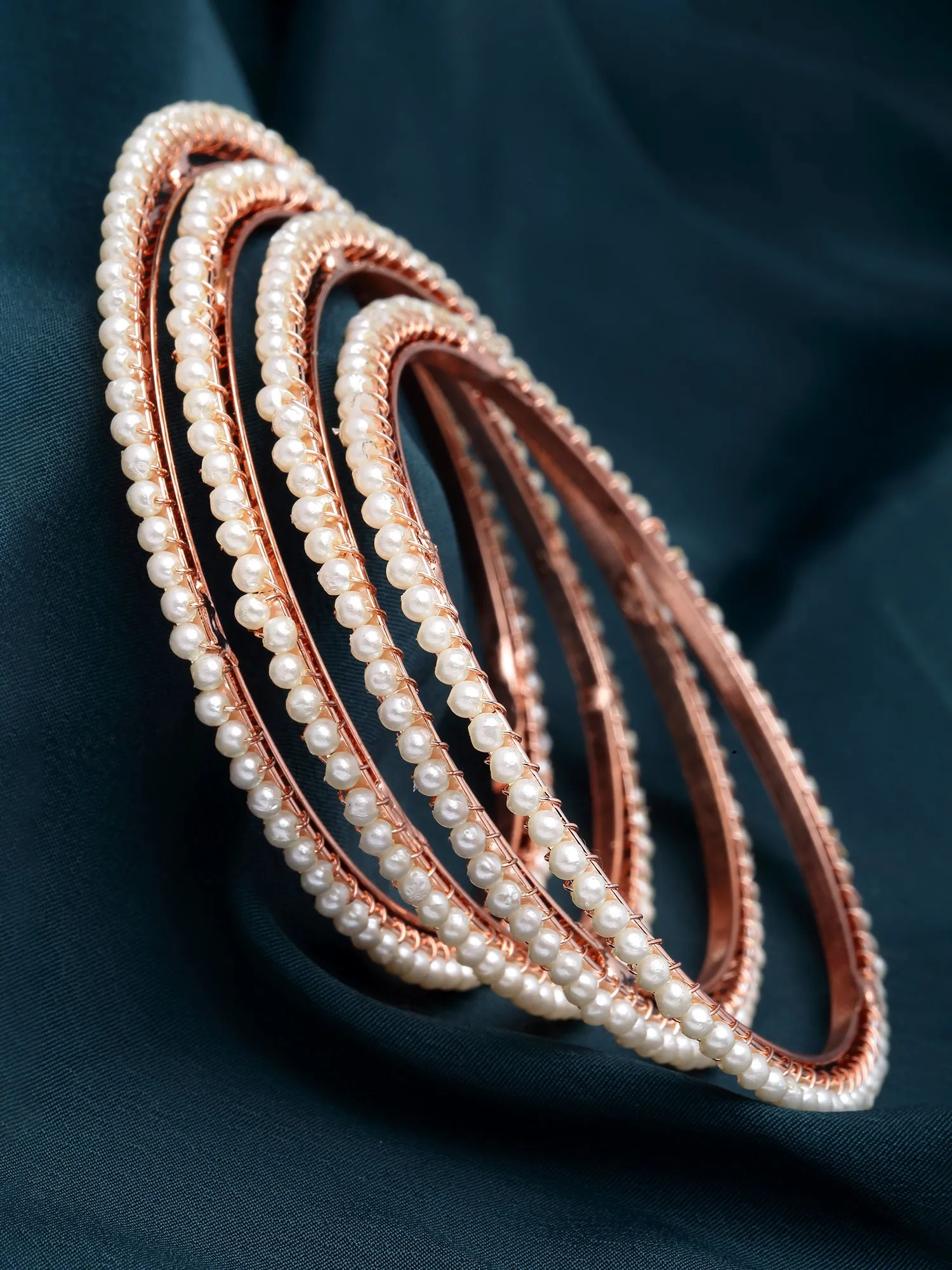 Karatcart Rose Gold Plated Set of 4 Pearl Studded Bangles for Women