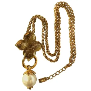 MINT. Vintage Yves Saint Laurent golden chain long statement necklace with extra large faux pearl and flower petal pendant top. Opal shine
