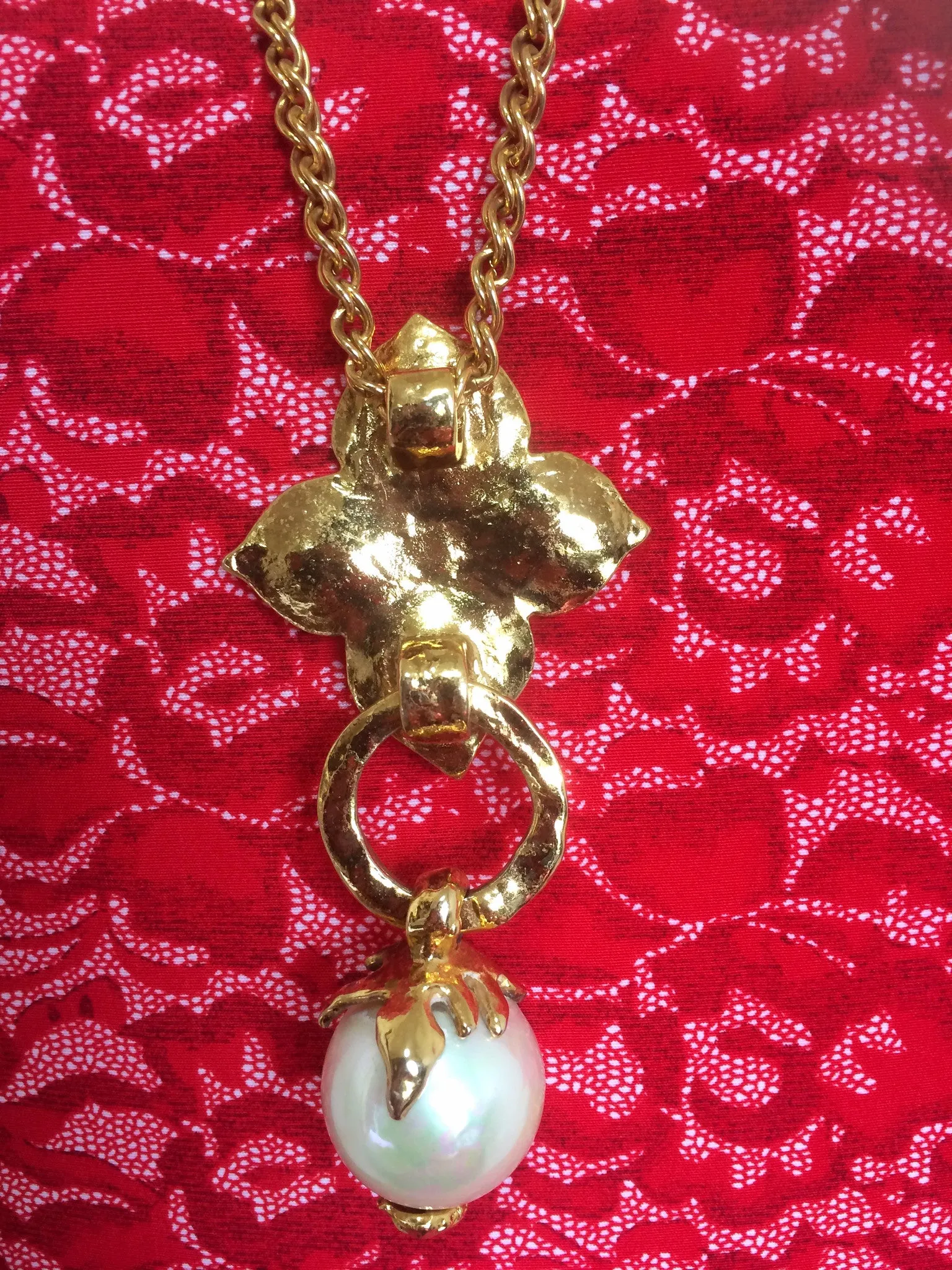 MINT. Vintage Yves Saint Laurent golden chain long statement necklace with extra large faux pearl and flower petal pendant top. Opal shine