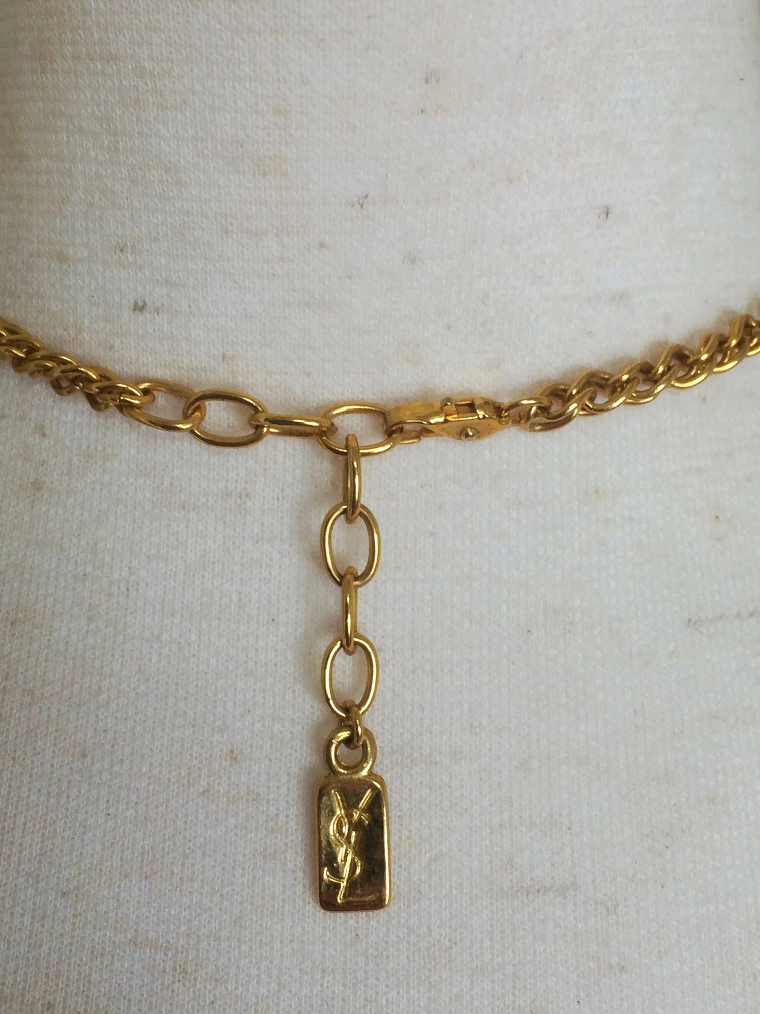 MINT. Vintage Yves Saint Laurent golden chain long statement necklace with extra large faux pearl and flower petal pendant top. Opal shine