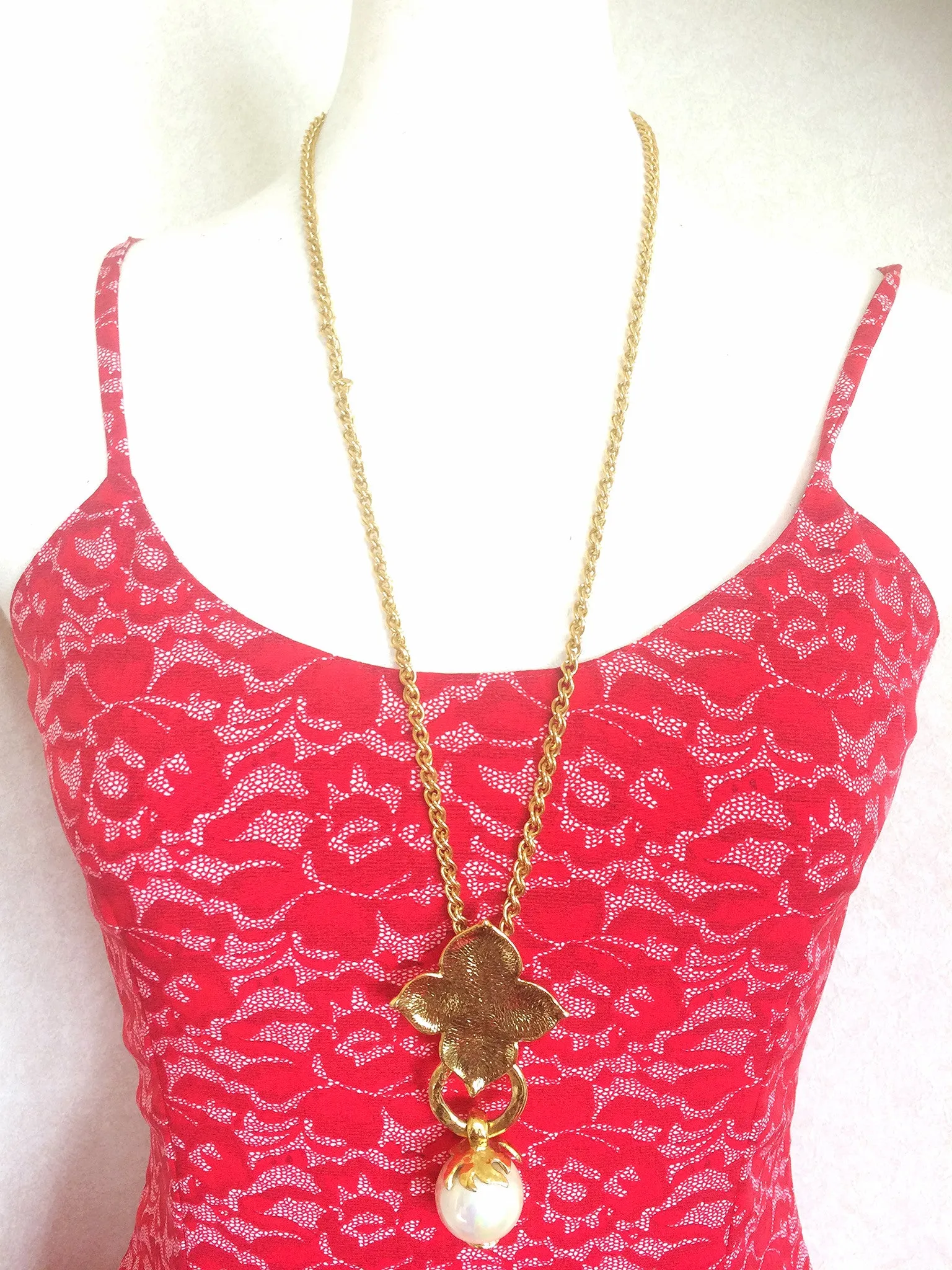 MINT. Vintage Yves Saint Laurent golden chain long statement necklace with extra large faux pearl and flower petal pendant top. Opal shine