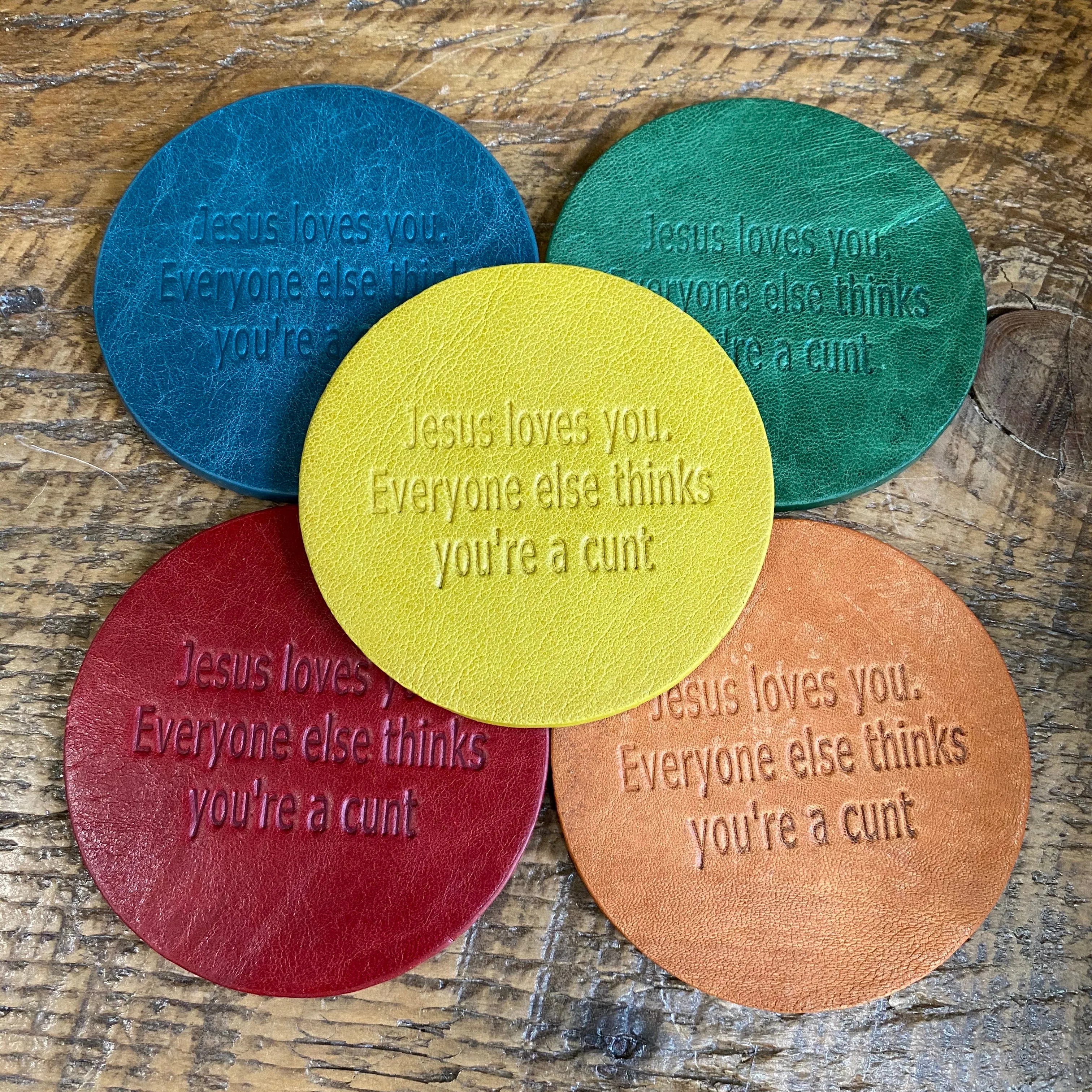 Snarky assorted color embossed leather coasters, sets of 5