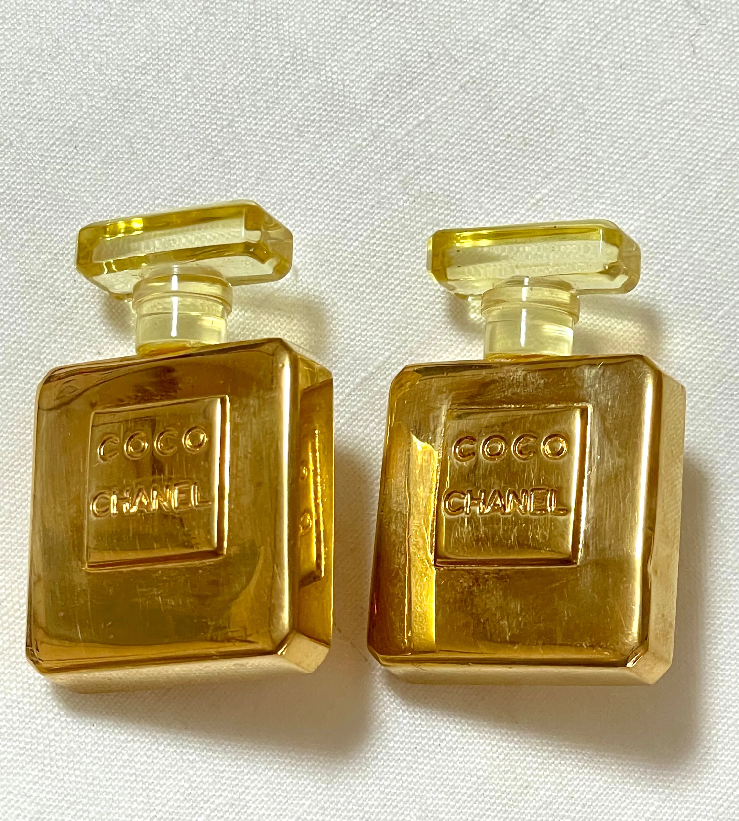 Vintage Chanel golden perfume bottle earrings with embossed logo. Large and heavy earrings. 070114ac2