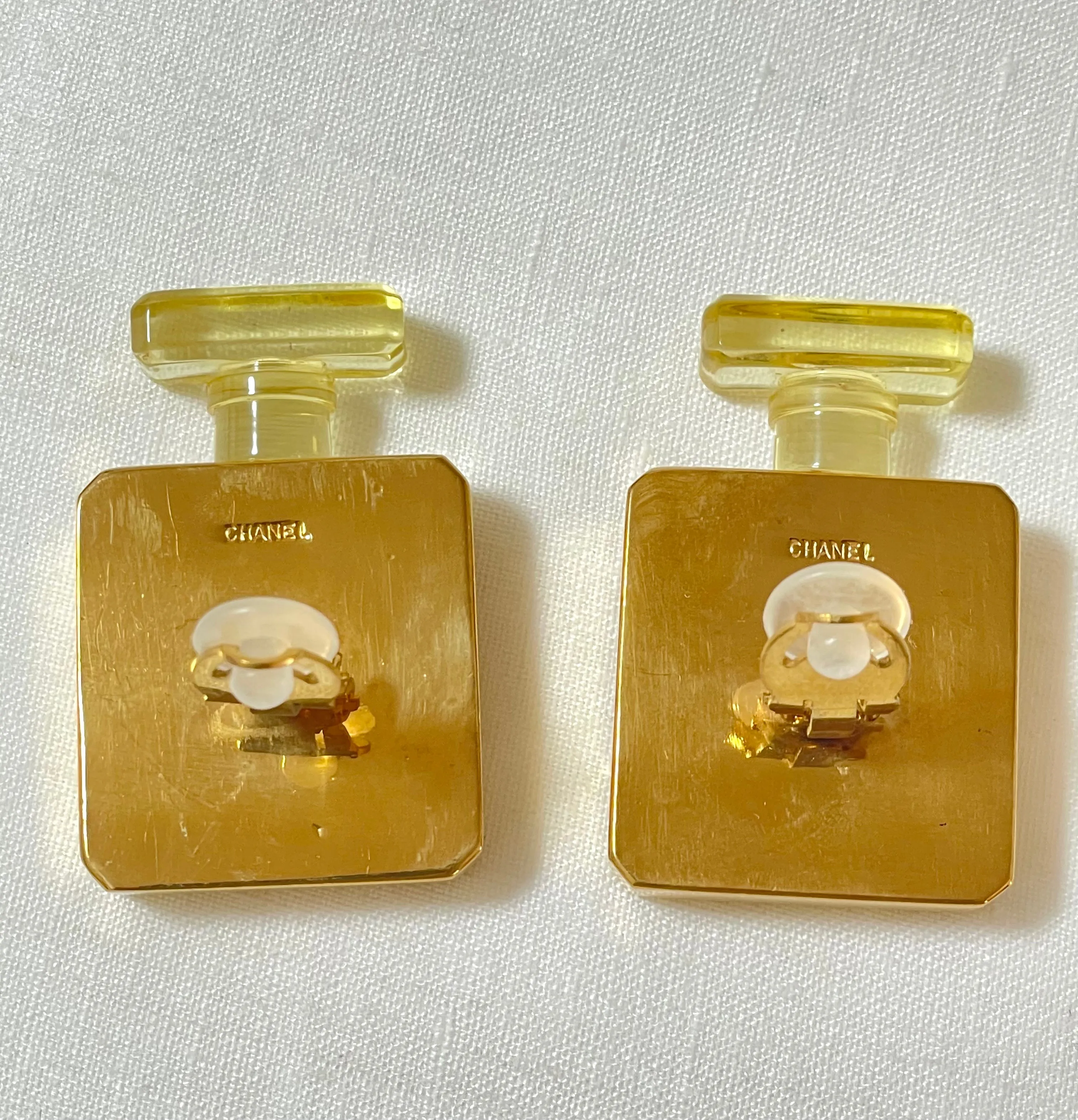 Vintage Chanel golden perfume bottle earrings with embossed logo. Large and heavy earrings. 070114ac2