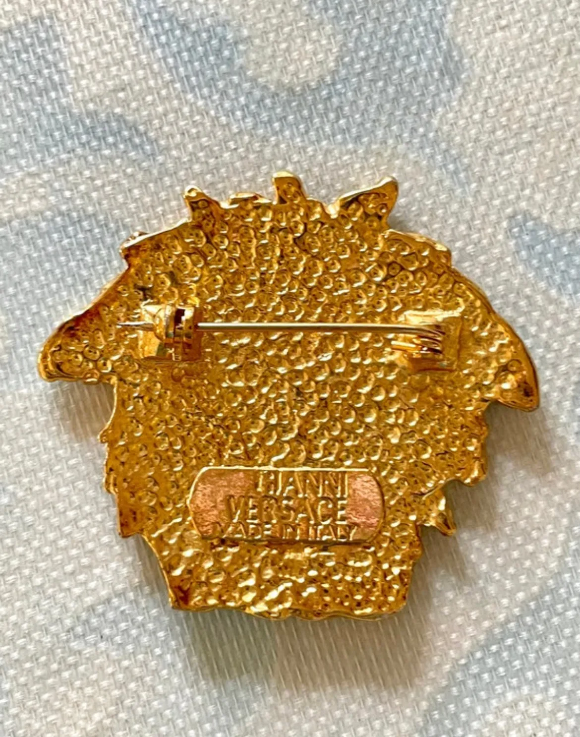 Vintage Gianni Versace gold medusa head face brooch. Can be hat, jacket pin. Great gift idea. 0410032