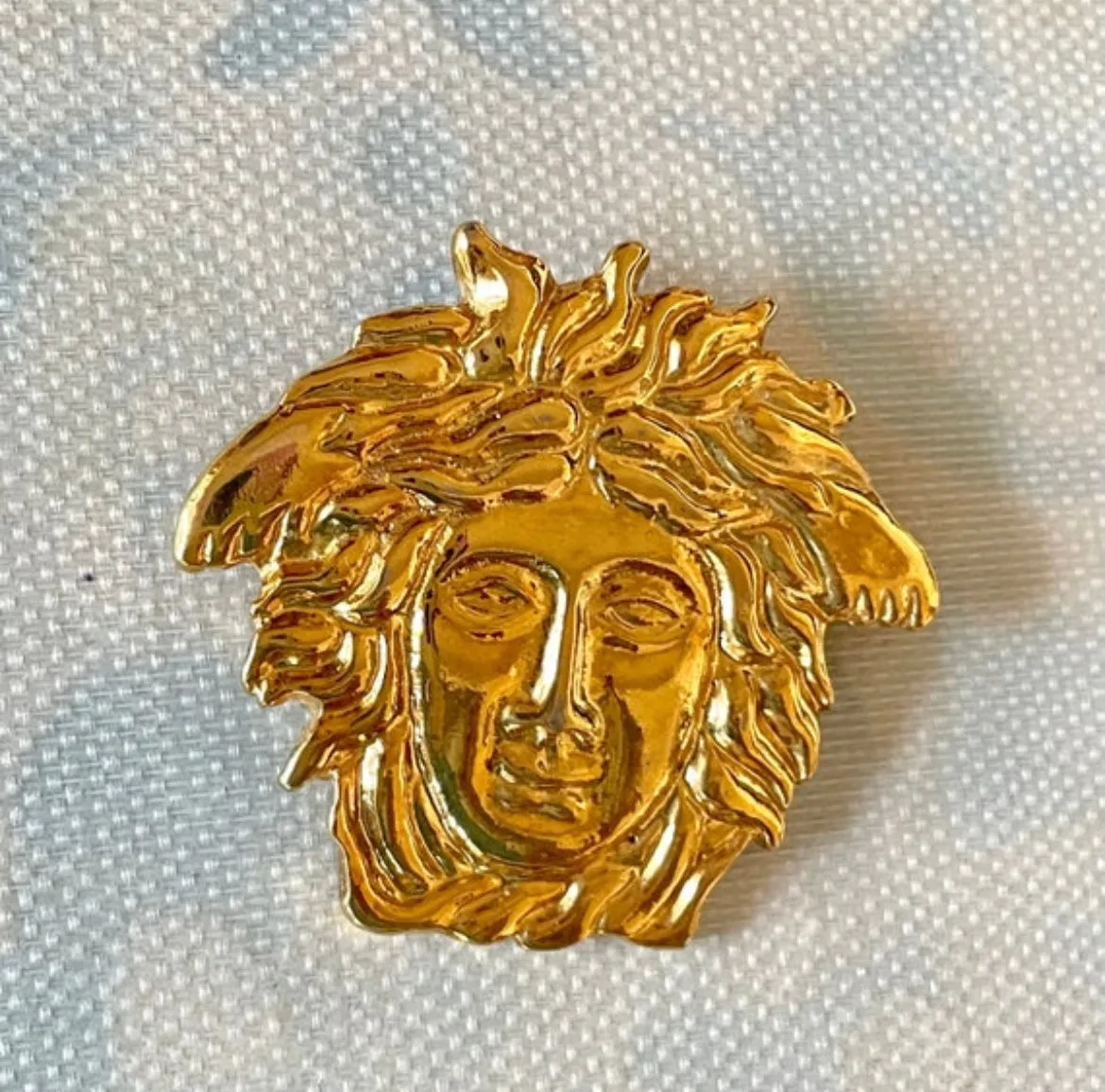 Vintage Gianni Versace gold medusa head face brooch. Can be hat, jacket pin. Great gift idea. 0410032