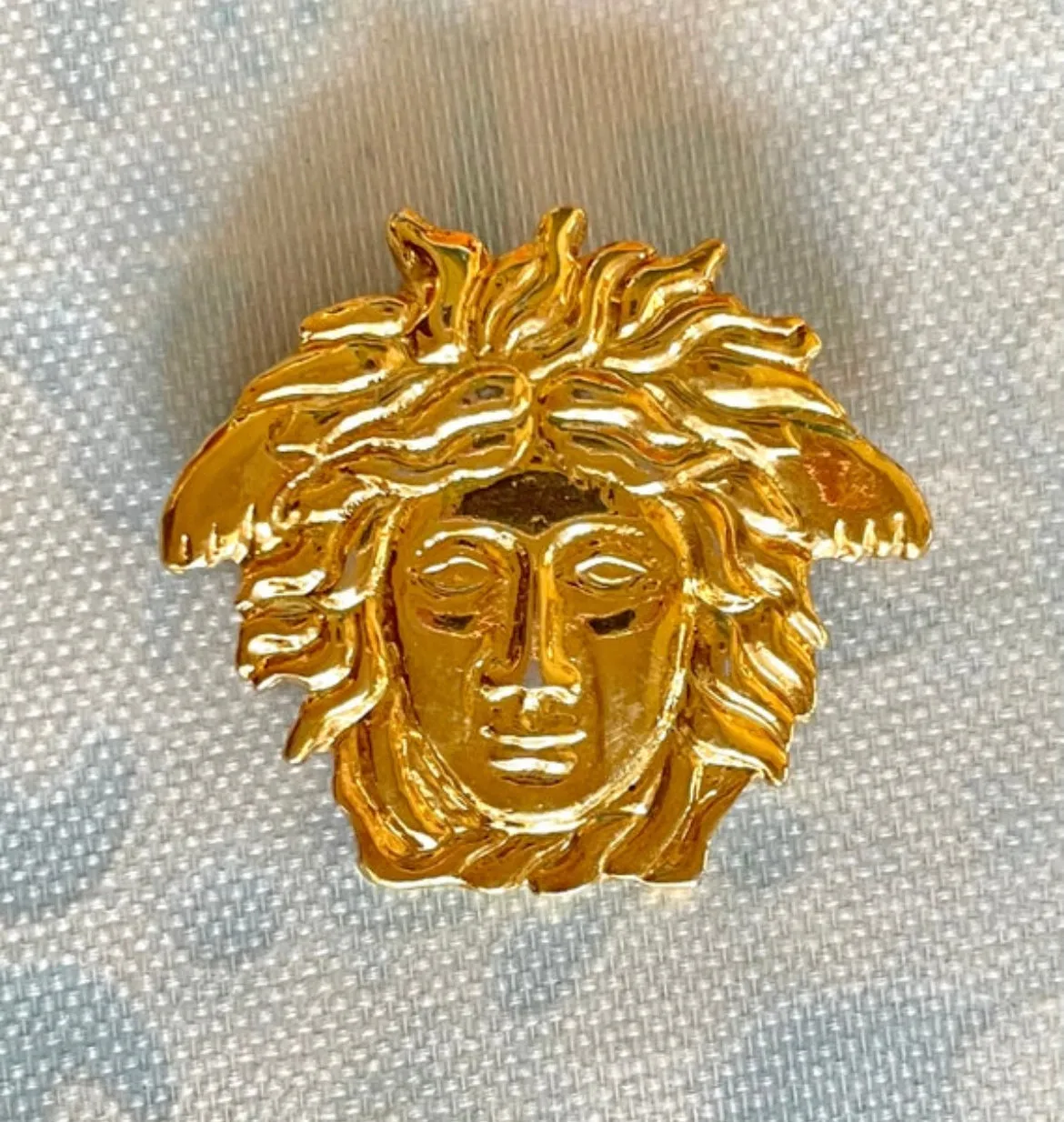 Vintage Gianni Versace gold medusa head face brooch. Can be hat, jacket pin. Great gift idea. 0410032