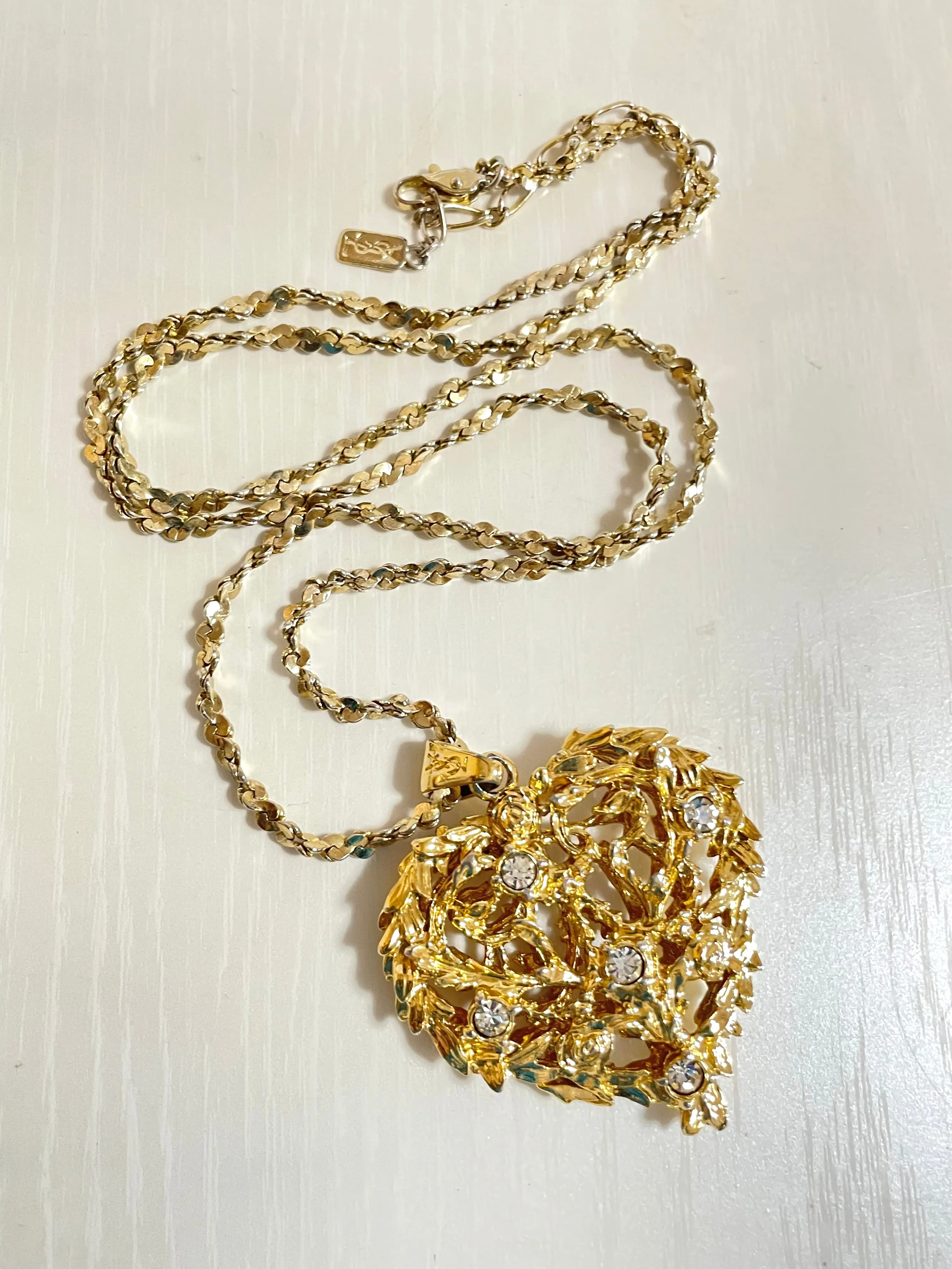 Vintage Yves Saint Laurent golden chain long statement necklace with arabesque heart and crystal pendant top. 050803y3